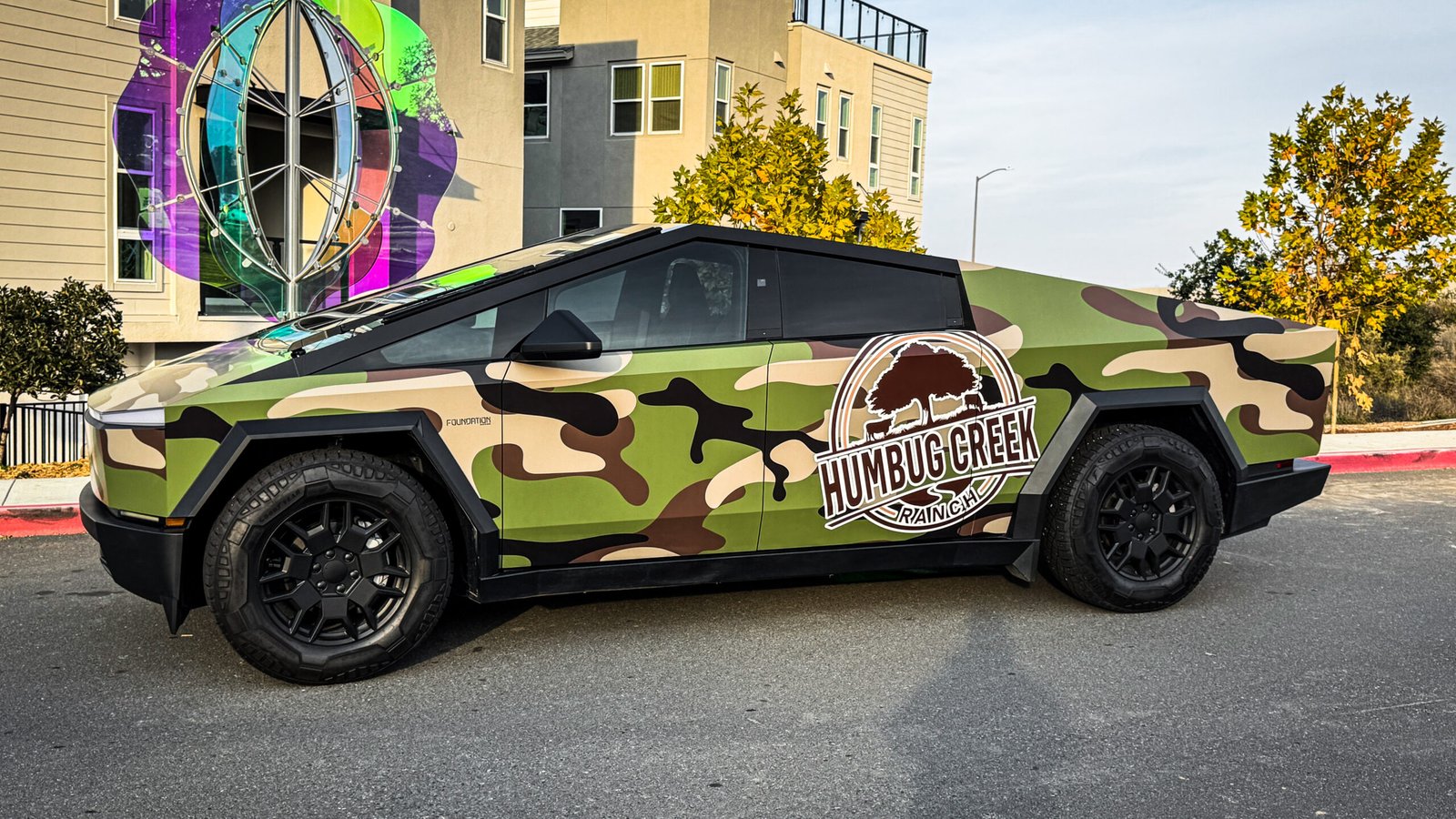 Custom camouflage green cyber truck wrap